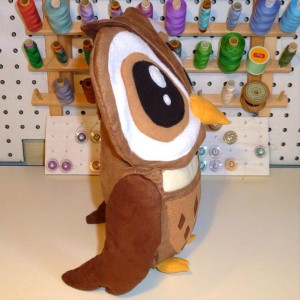 Owl plush toy hood up side view